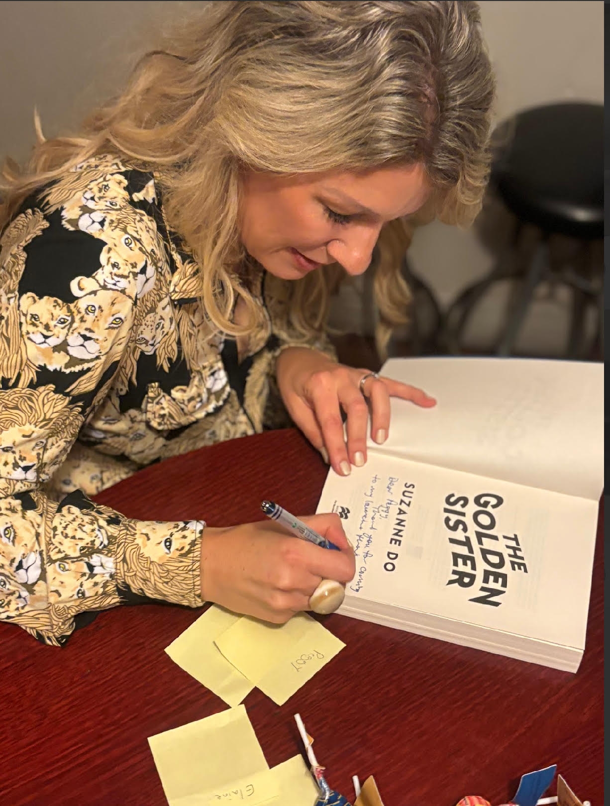 Signing a copy of The Golden Sister at the Thirroul launch event-Suzanne Do